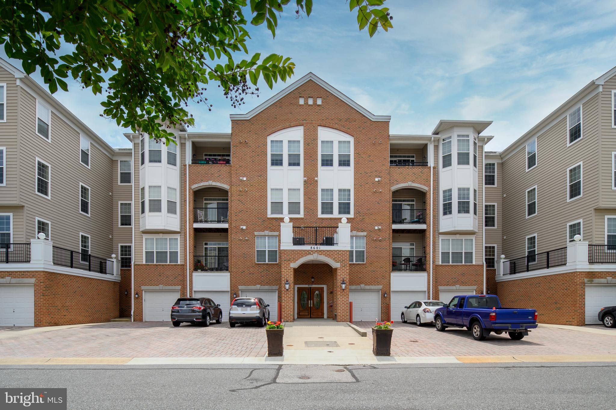 8601 Roaming Ridge Way, Unit 304 Odenton, MD 21113 - Photo 40 of 40 a car parked in front of a building