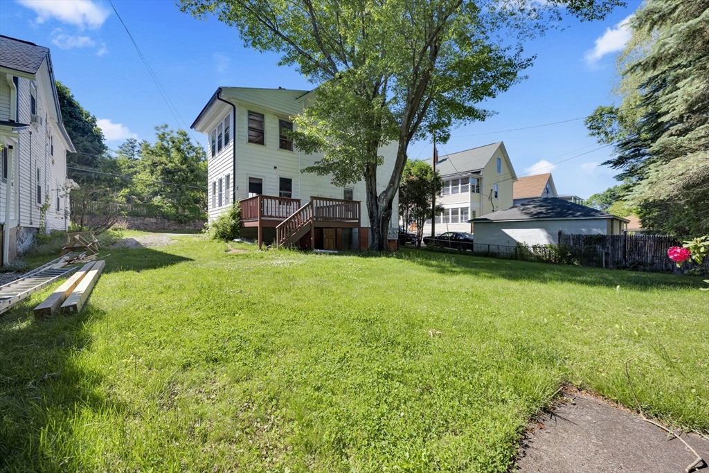 47 Morris Street Southbridge, MA 01550 - Photo 28 of 40 a view of a house with a yard and sitting area