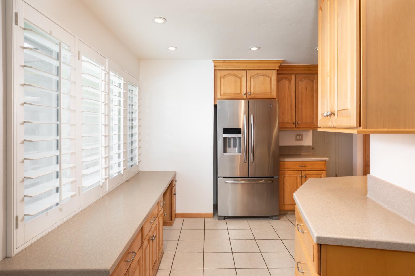 1937 Adelaide Way San Jose, CA 95124 - Photo 9 of 33 a kitchen with a refrigerator a sink and cabinets