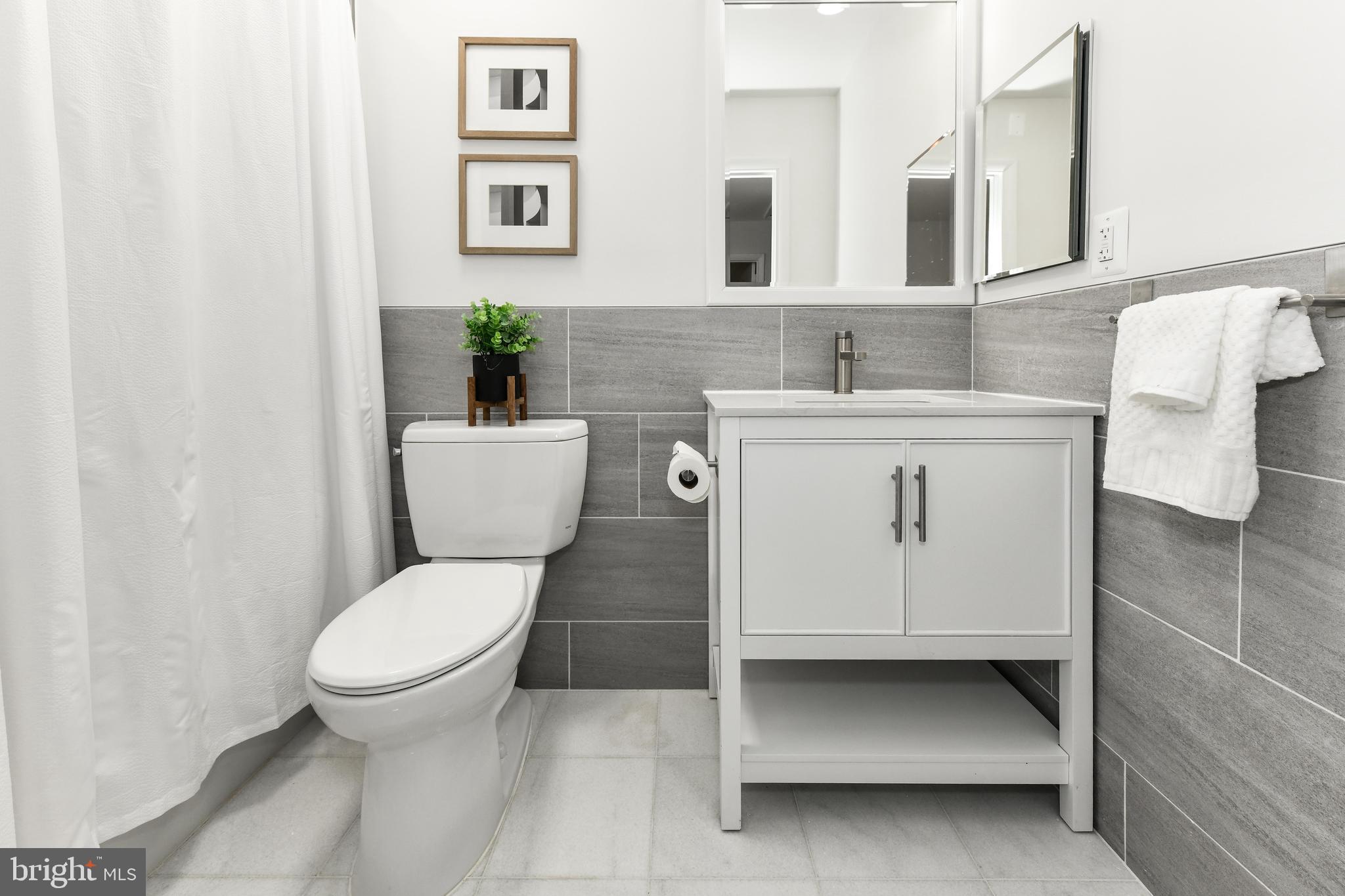11701 Newbridge Court Reston, VA 20191 - Photo 33 of 64 New vanity, toilet, lighting, tile, flooring etc.