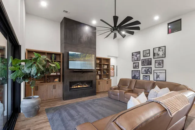 a living room with furniture and a fireplace
