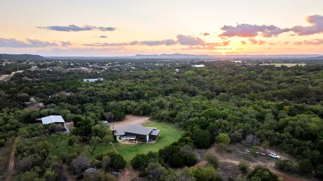 an aerial view of a house with mountain view