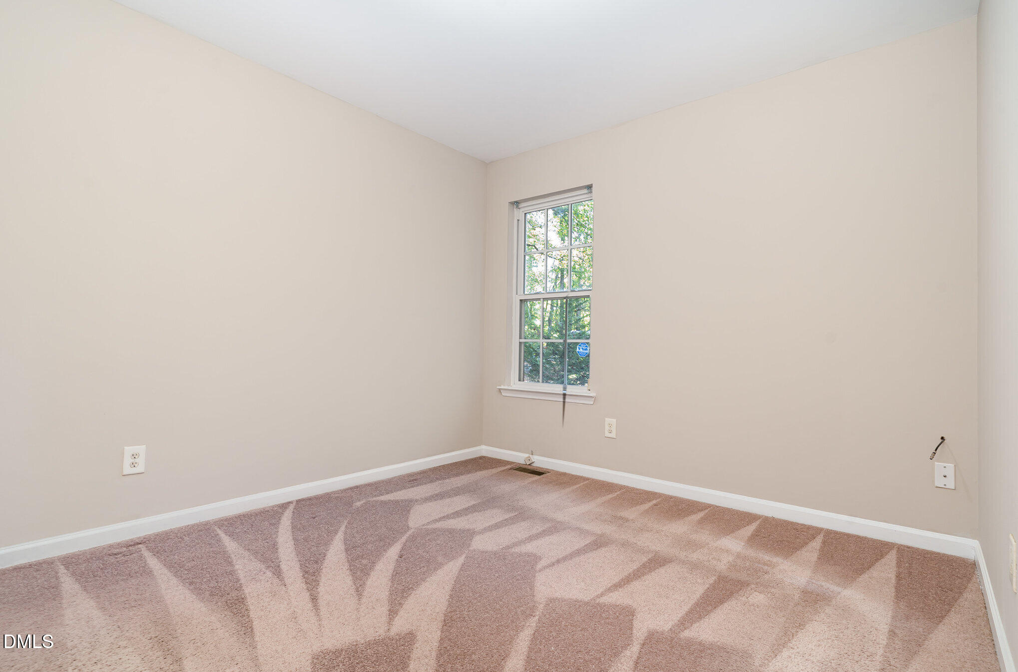 5414 Stanley Road Durham, NC 27704 - Photo 12 of 20 a view of an empty room with a window