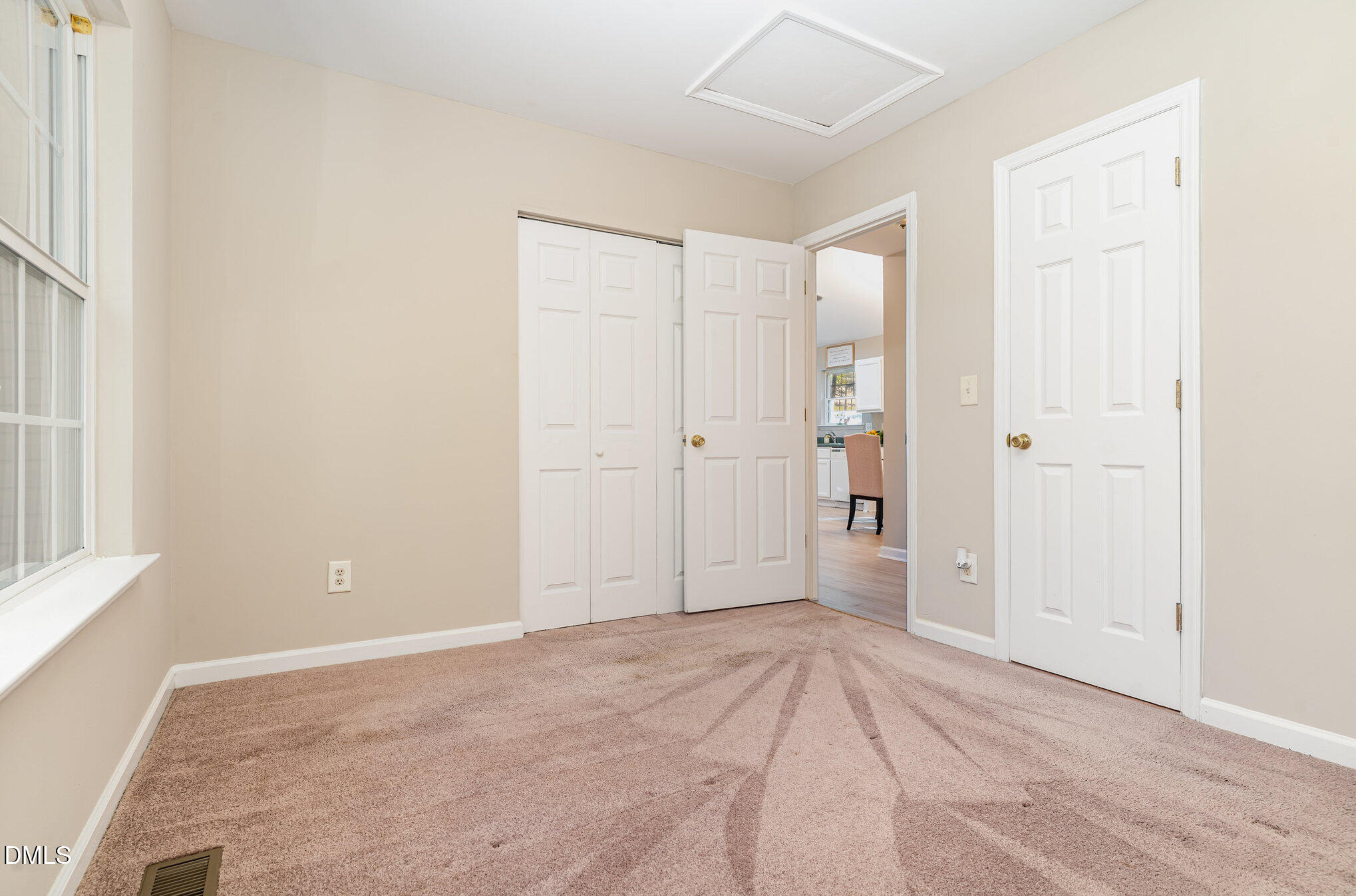 5414 Stanley Road Durham, NC 27704 - Photo 13 of 20 an empty room with closet and windows