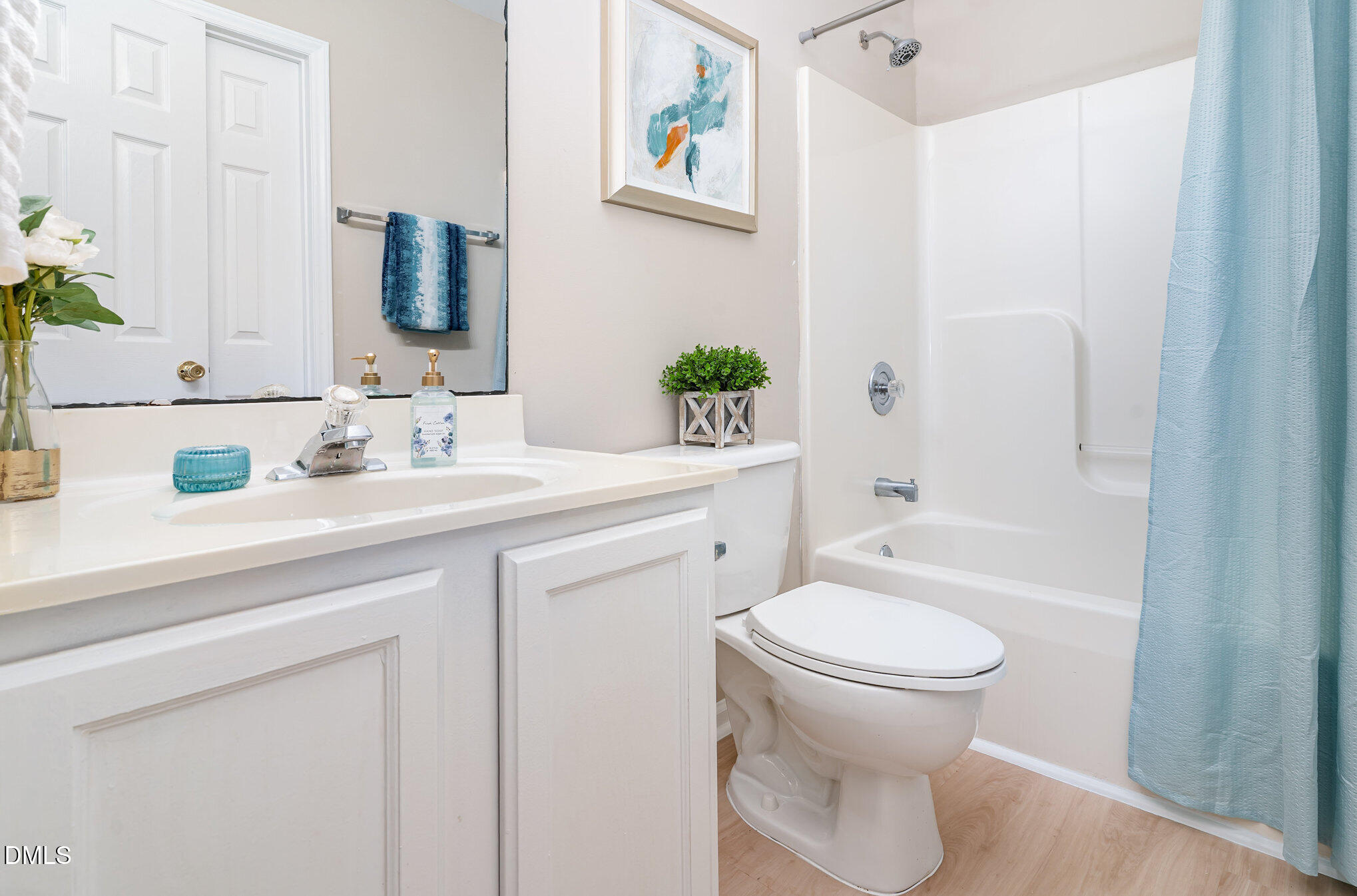 5414 Stanley Road Durham, NC 27704 - Photo 14 of 20 a bathroom with a sink toilet and shower
