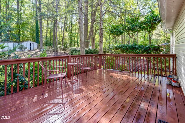 a view of balcony with wooden floor and outdoor seating