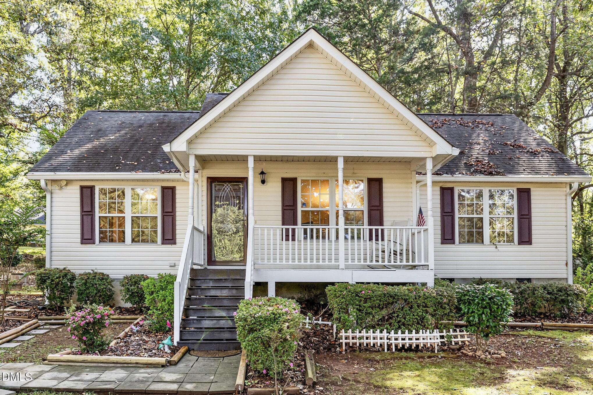 5414 Stanley Road Durham, NC 27704 - Photo 19 of 20 a front view of a house with a garden
