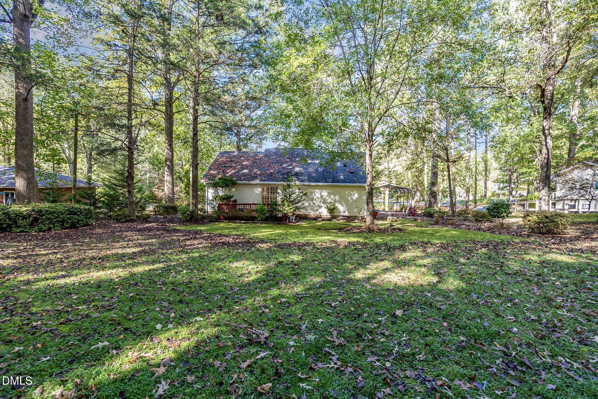 5414 Stanley Road Durham, NC 27704 - Photo 20 of 20 a view of a yard with plants and trees