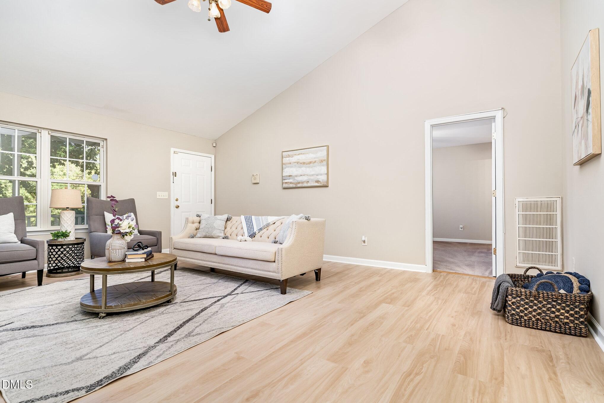 5414 Stanley Road Durham, NC 27704 - Photo 2 of 20 a living room with furniture and a wooden floor
