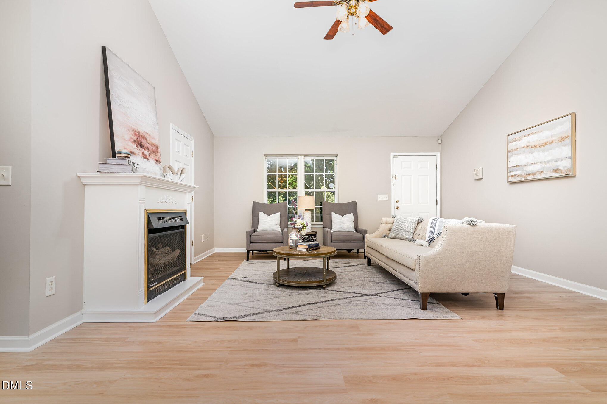 5414 Stanley Road Durham, NC 27704 - Photo 8 of 20 a living room with furniture and a fireplace