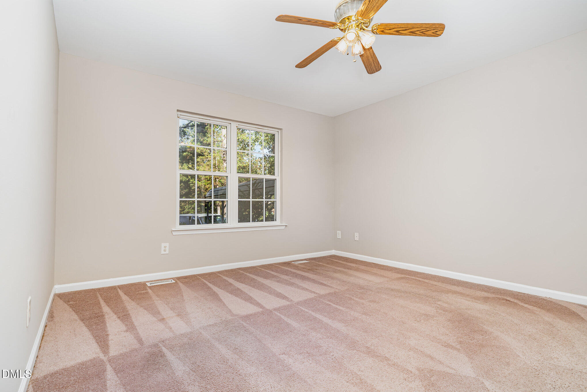 5414 Stanley Road Durham, NC 27704 - Photo 9 of 20 an empty room with windows and fan