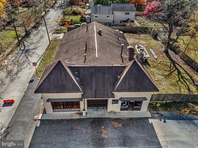 a stove top oven sitting inside of a kitchen