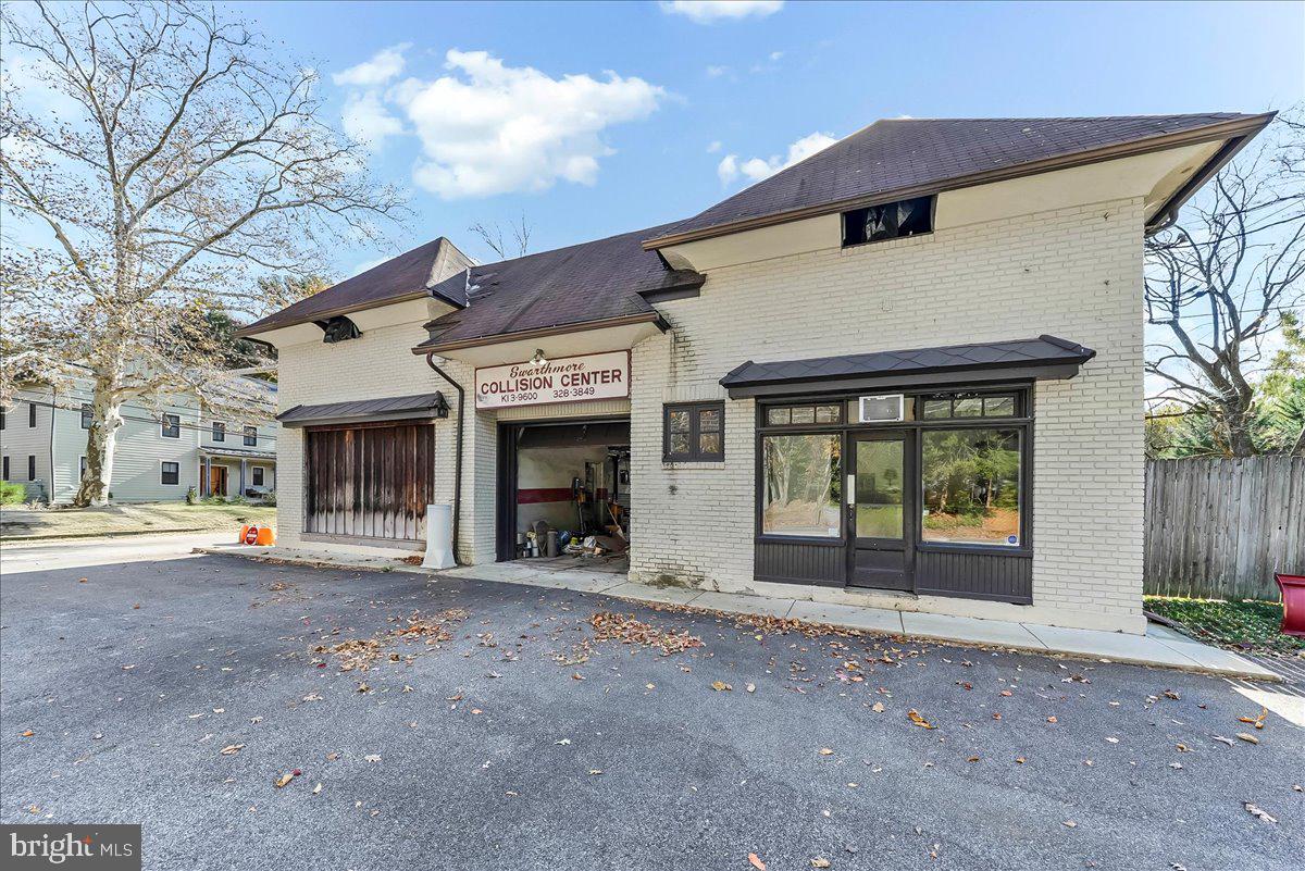 630 Yale Avenue Swarthmore, PA 19081 - Photo 21 of 24 a view of a house with large windows and a small yard