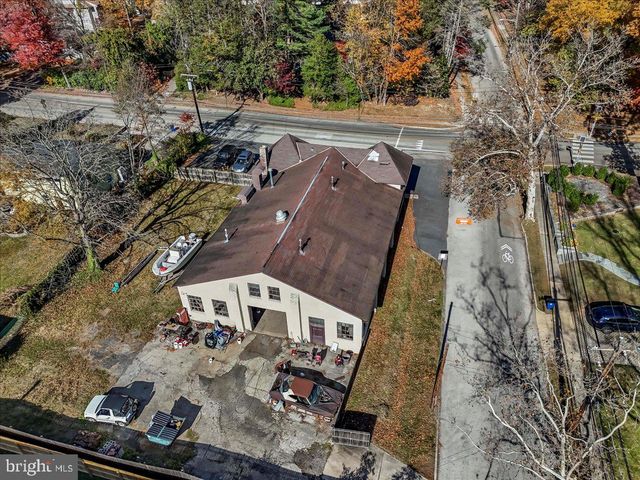 an aerial view of a house with yard