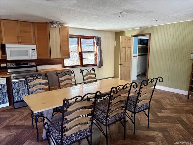 a view of a dining room with furniture