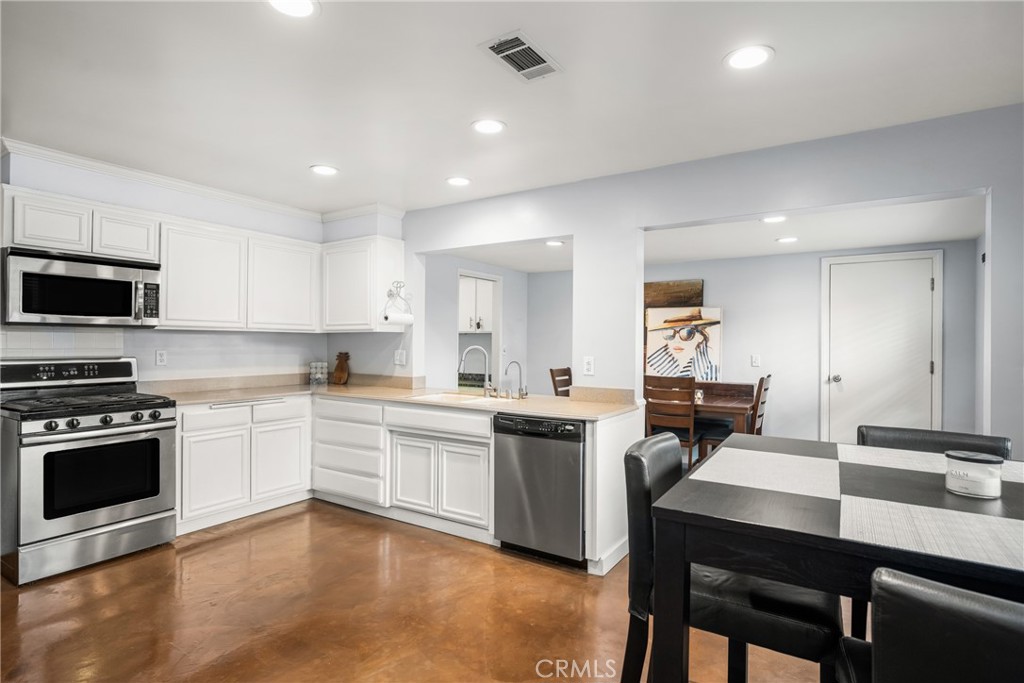 19301 Maynard Way North Tustin, CA 92705 - Photo 4 of 24 Large kitchen is open to dining room and features casual dining as well.