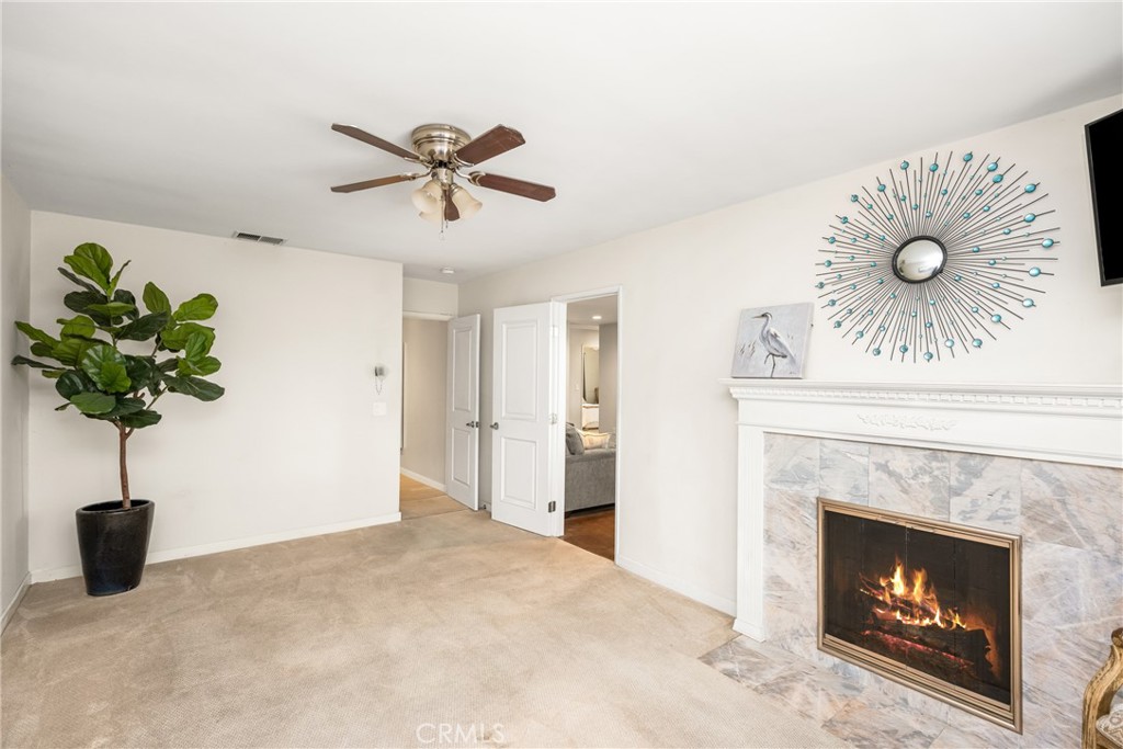 19301 Maynard Way North Tustin, CA 92705 - Photo 8 of 24 Large Primary Bedroom features a fireplace and ensuite remodeled Primary bath.