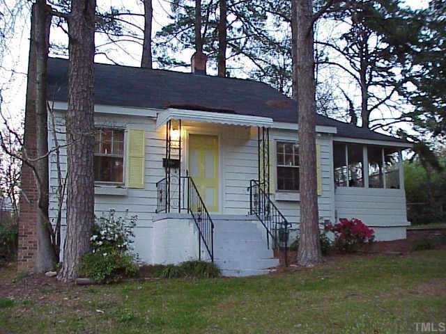 front view of a house with a garden