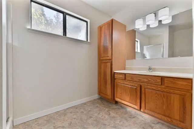 a bathroom with a sink and a mirror
