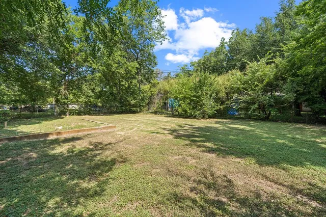 a view of outdoor space with trees all around