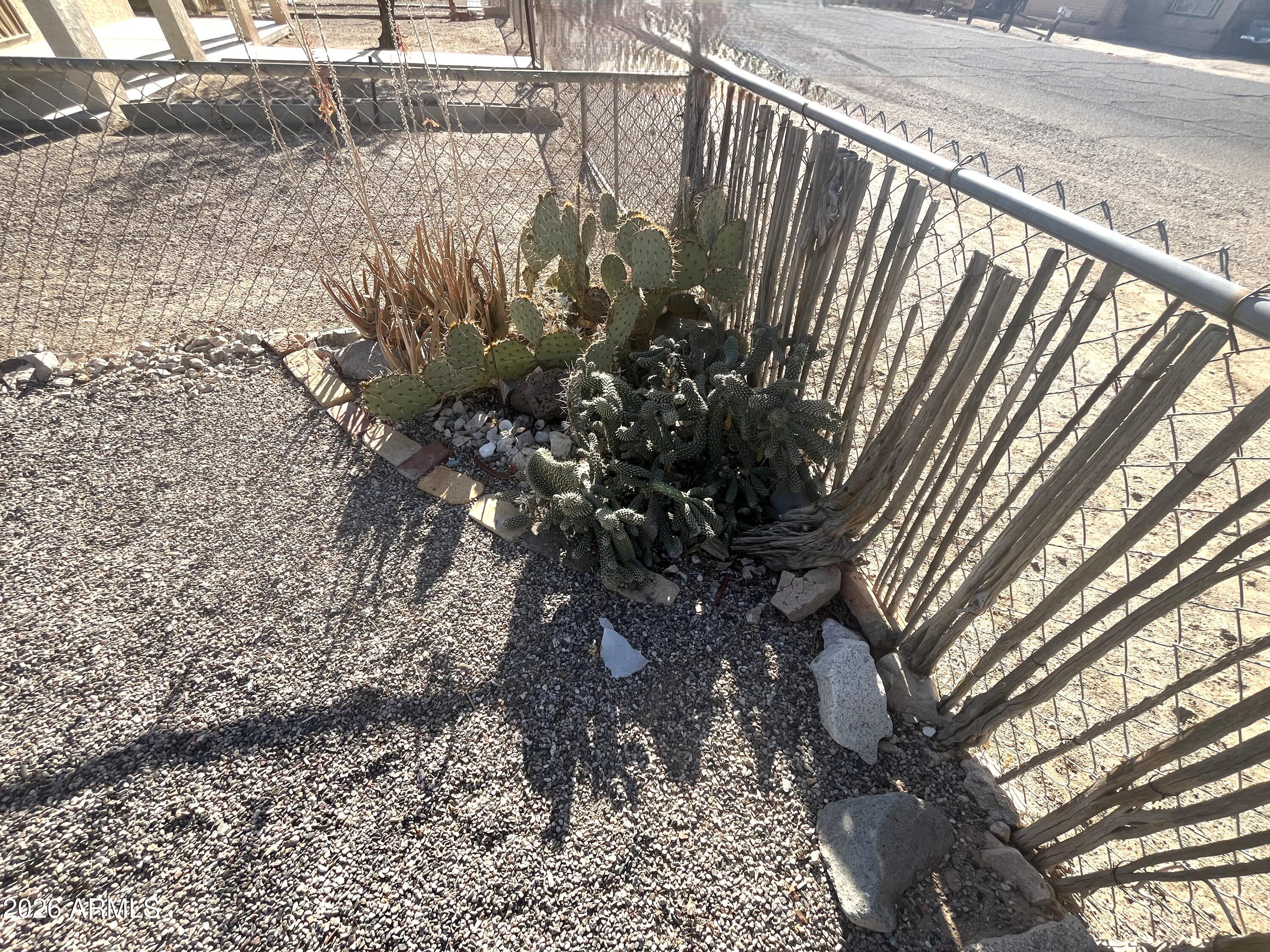 640 West Rocalla Avenue Ajo, AZ 85321 - Photo 22 of 27 a view of a backyard of the house