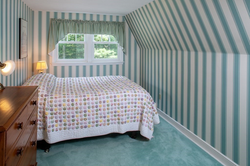 40 Union Hall Road Duxbury, MA 02332 - Photo 11 of 18 a bed sitting in a bedroom next to a window