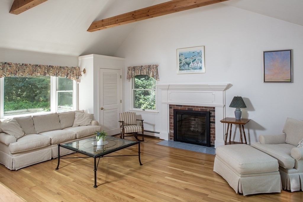 40 Union Hall Road Duxbury, MA 02332 - Photo 2 of 18 a living room with furniture and a fireplace