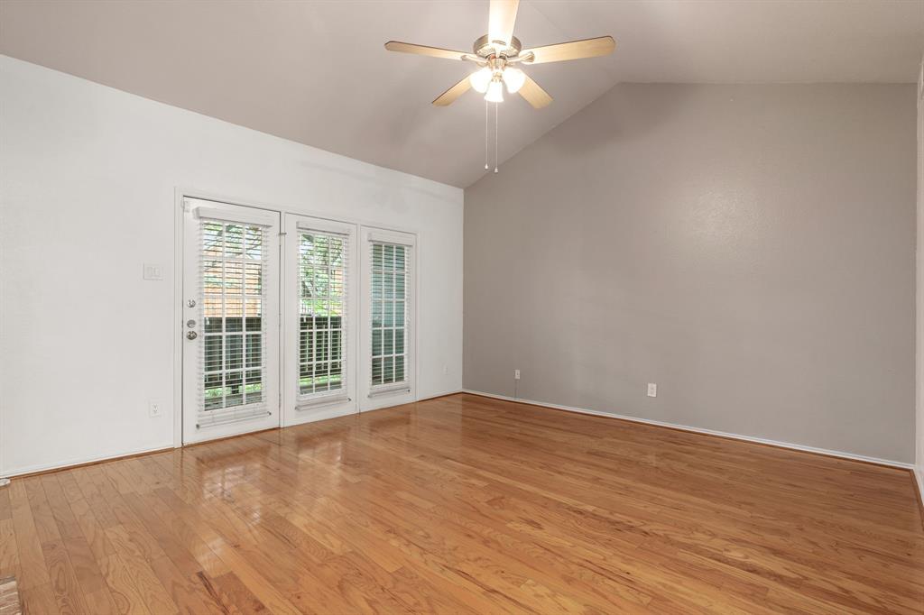 12660 Hillcrest Road, Unit 4203 Dallas, TX 75230 - Photo 5 of 16 Empty room featuring light hardwood / wood-style floors, vaulted ceiling, and ceiling fan