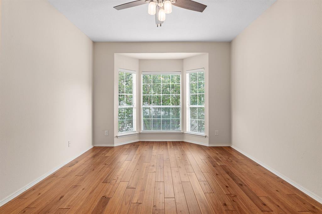 12660 Hillcrest Road, Unit 4203 Dallas, TX 75230 - Photo 10 of 16 Empty room featuring ceiling fan and light hardwood / wood-style flooring