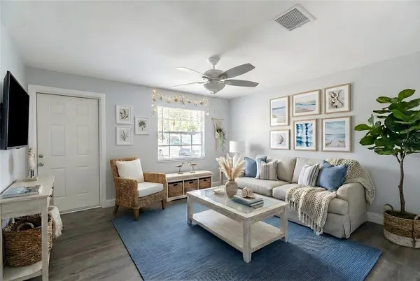 a living room with furniture and a large window