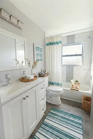 a bathroom with double vanity sink a mirror and a bathtub