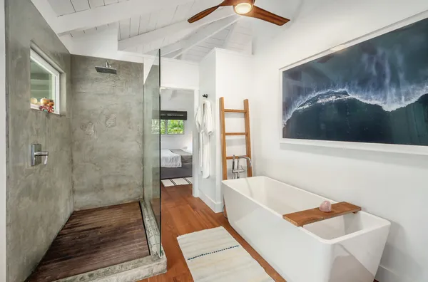 a spacious bathroom with a tub and shower