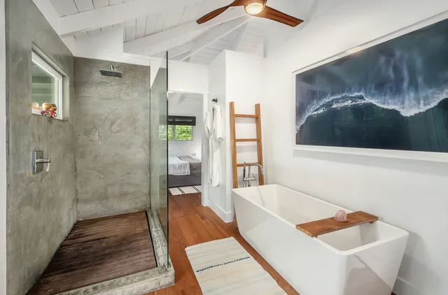 a spacious bathroom with a tub and shower