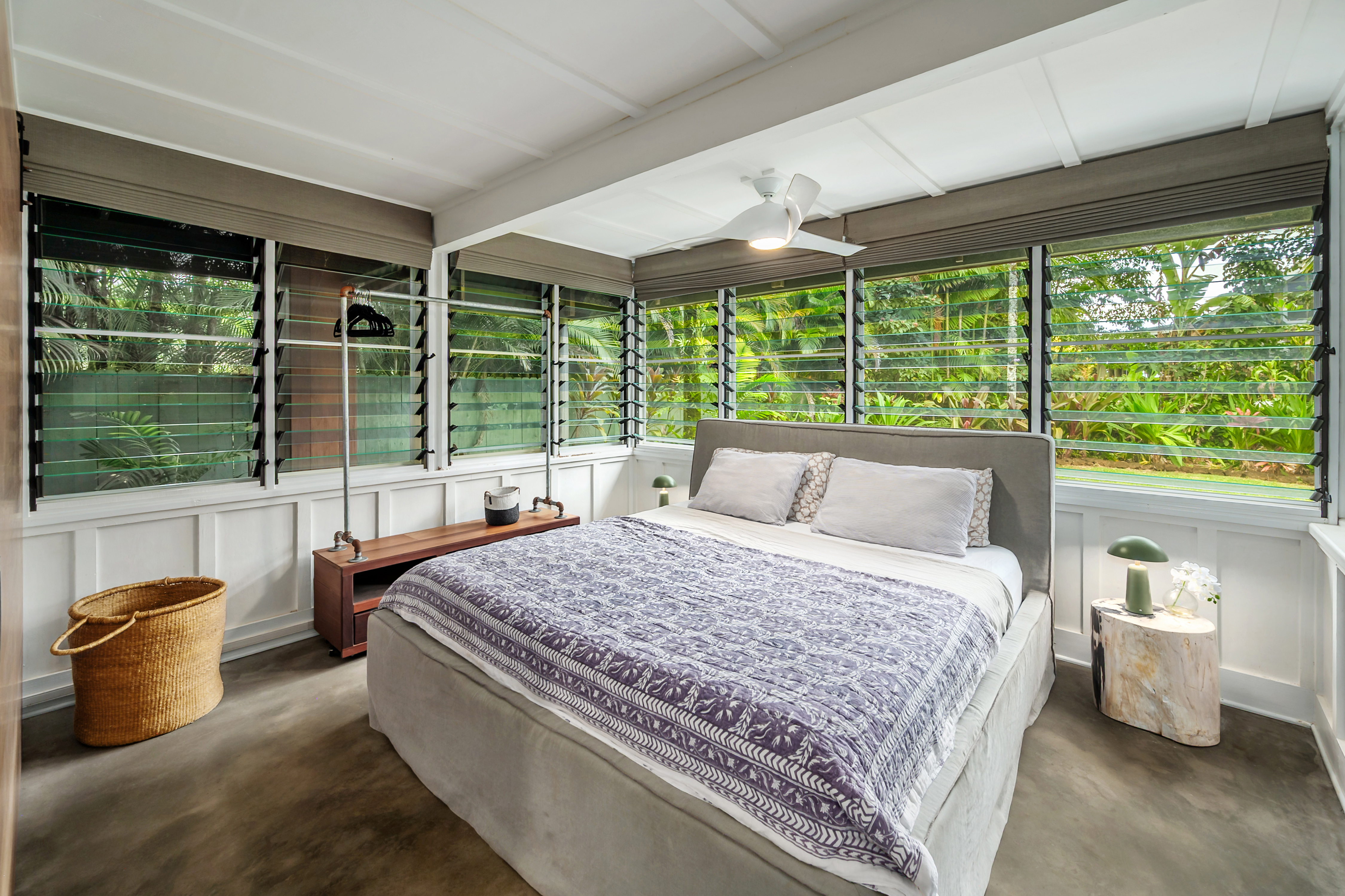 5410 Weke Road Hanalei, HI 96714 - Photo 14 of 23 a bedroom with a bed and large windows