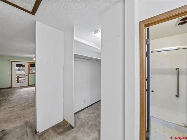 an empty room with a empty space and window