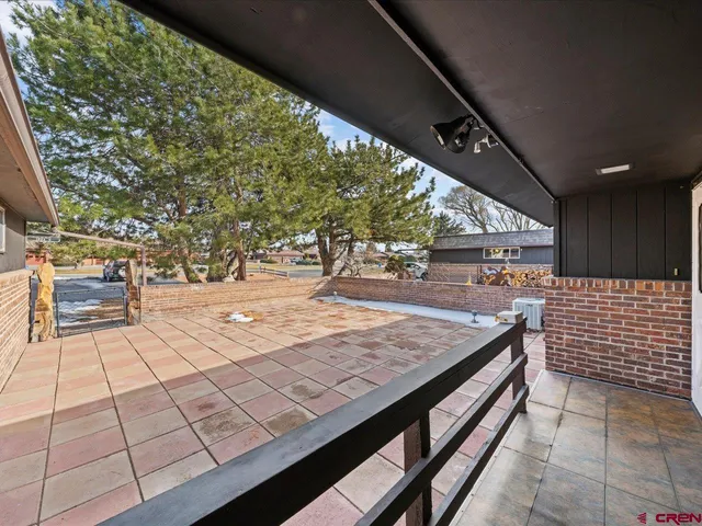 a view of a kitchen with wooden floor and a kitchen