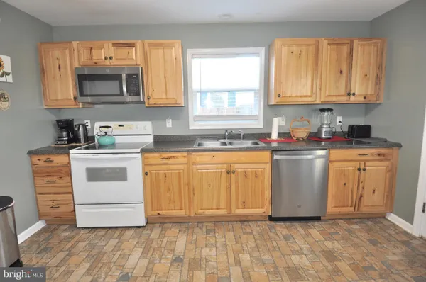 a utility room with sink dryer and washer