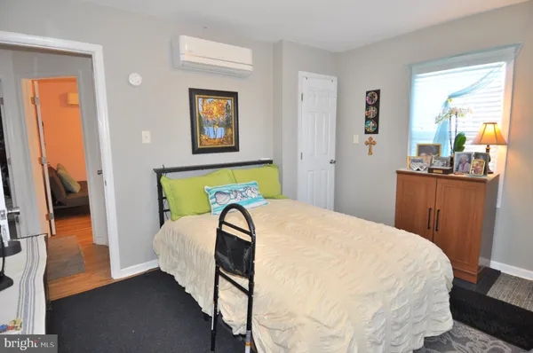 a bathroom with a sink mirror and toilet