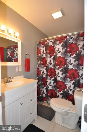 a bedroom with furniture and a flat screen tv