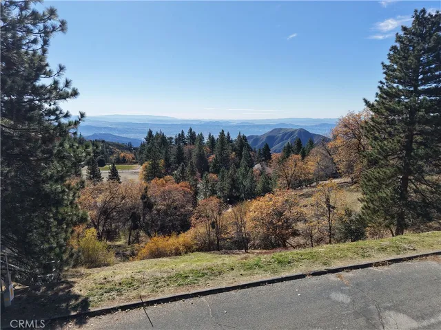 a view of a yard and a mountain