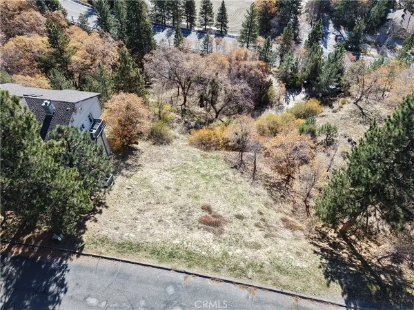 an aerial view of residential house with parking and parking space