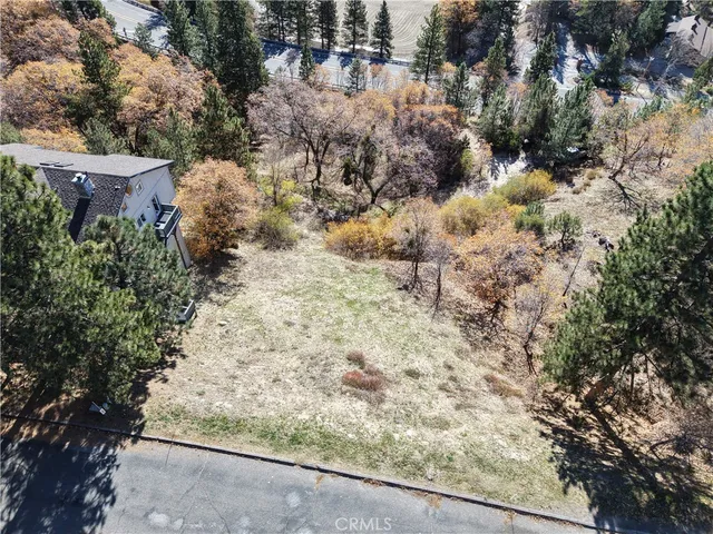 an aerial view of residential house with parking and parking space