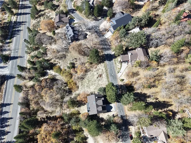 a aerial view of a house with a yard