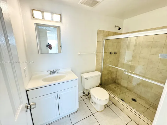 a view of a house with backyard and a large window