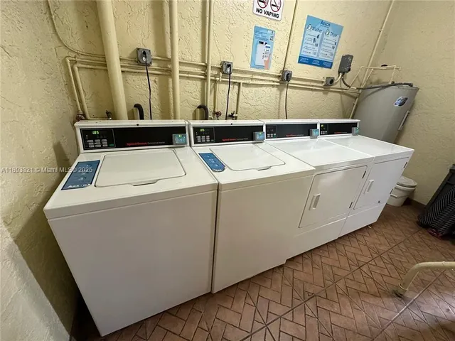 a view of a house with a big yard and potted plants