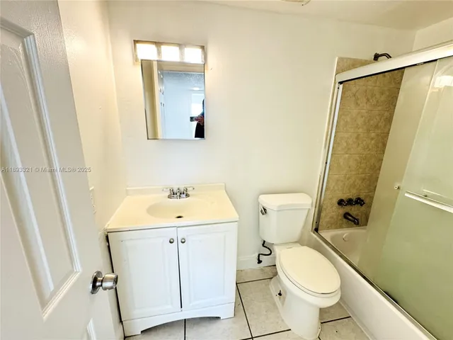 a view of empty room with windows