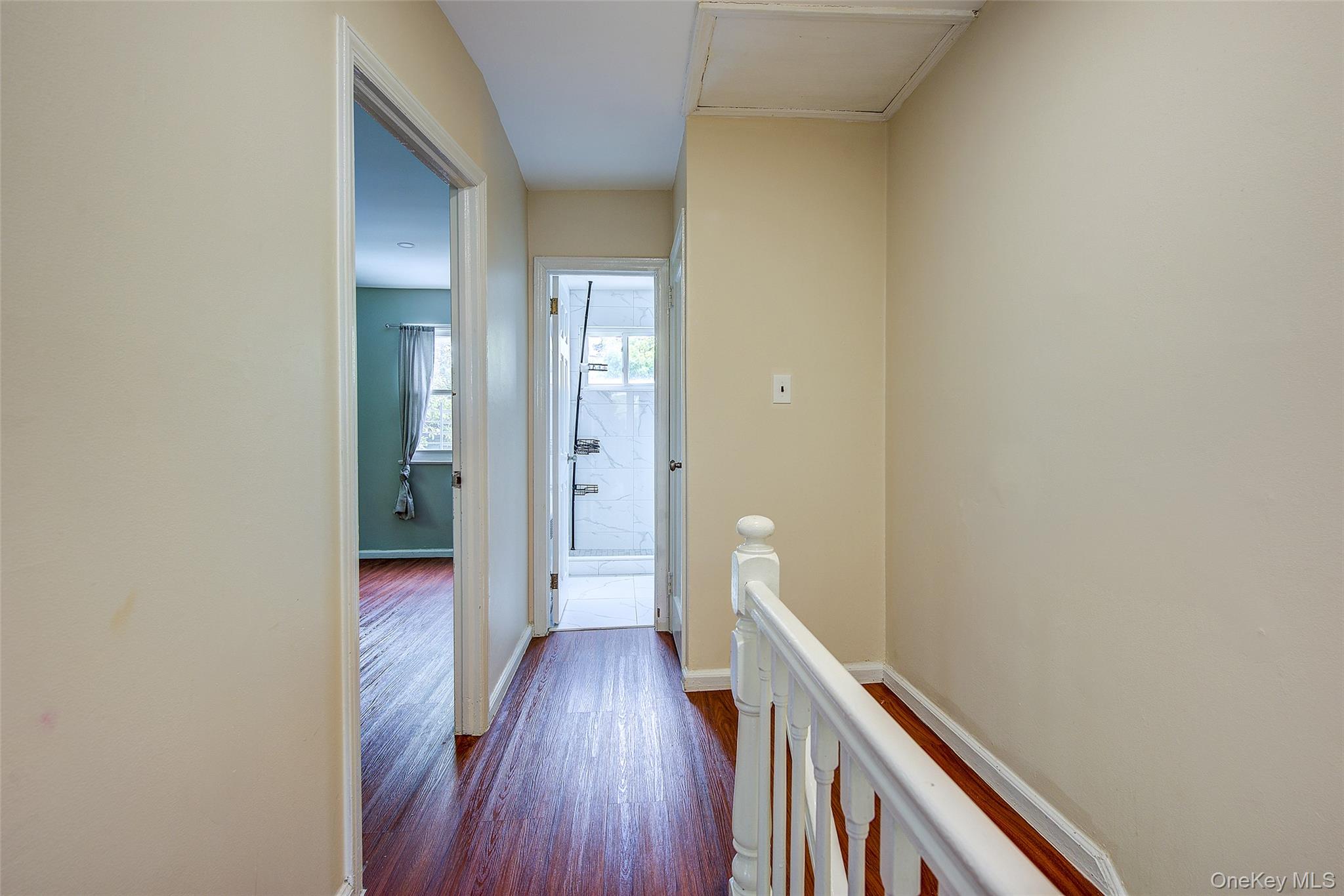 164-38 76th Road Queens, NY 11366 - Photo 14 of 44 a view of a hallway with wooden floor