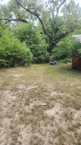 a view of a yard with an outdoor space