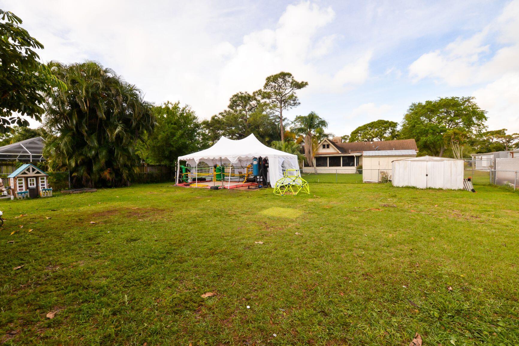 6105 Raintree Trail Fort Pierce, FL 34982 - Photo 30 of 35 Large, Spacious, Fenced Yard