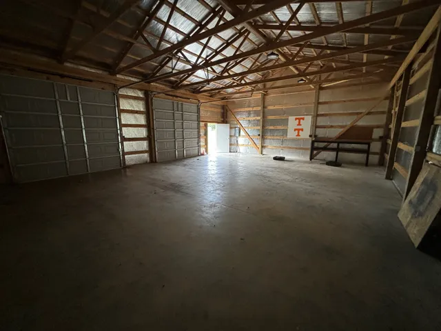 a view of a room with wooden walls